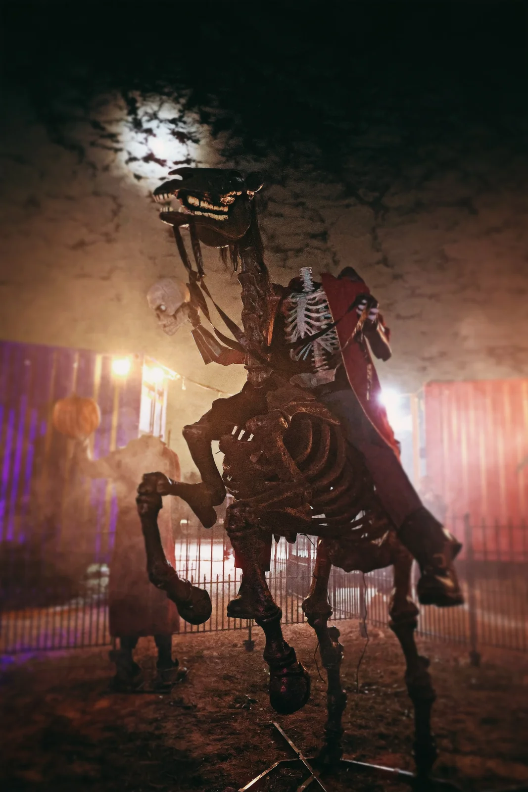 A skeletal rider rises over a gate in the fog at Nightmare Farms.