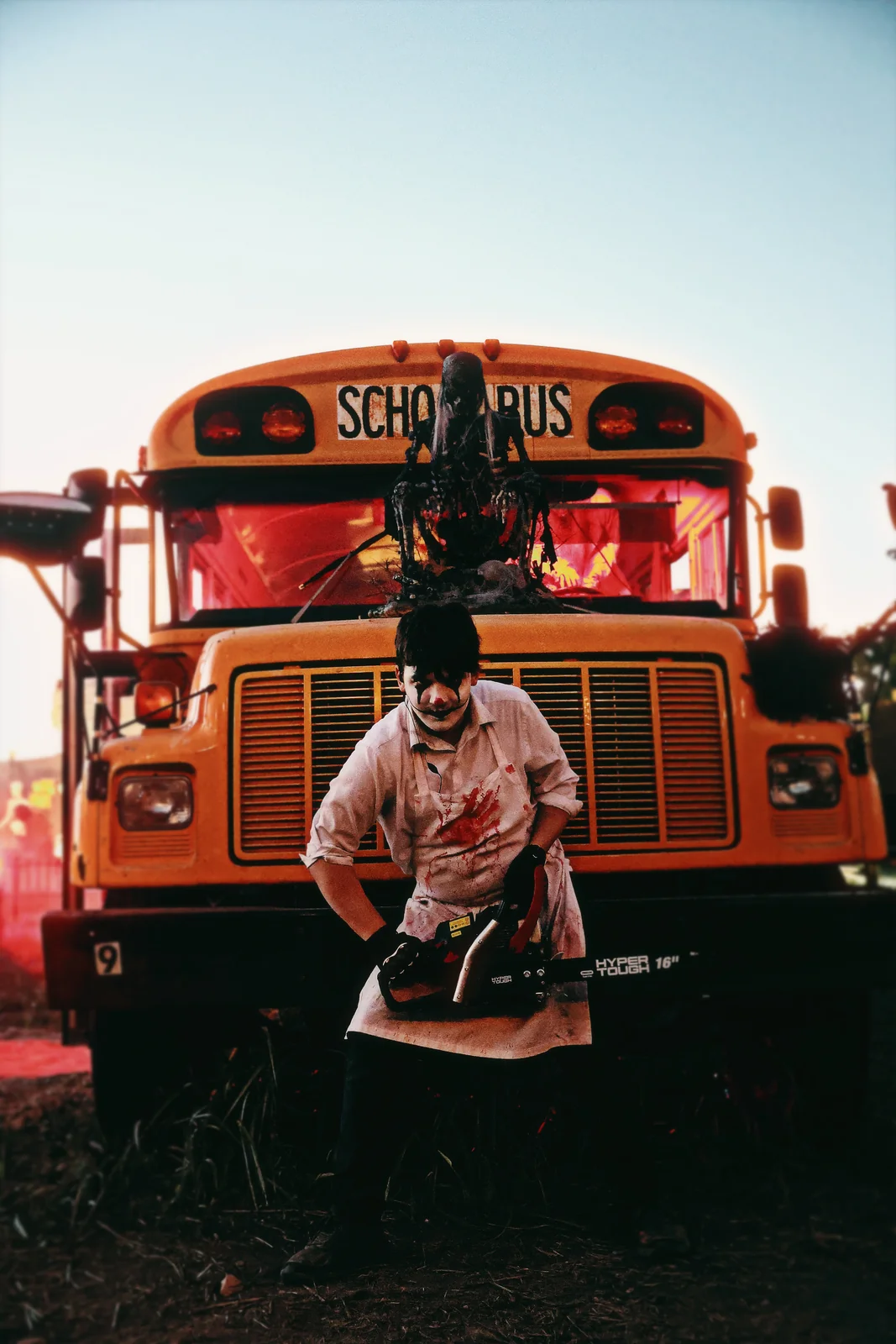 A scare actor stands in front of the Zombie Bus at Nightmare Farms.